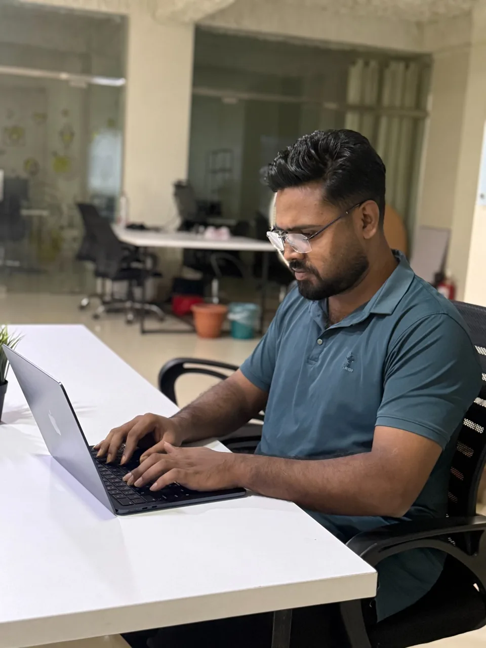 Jibon working on a website at his desk